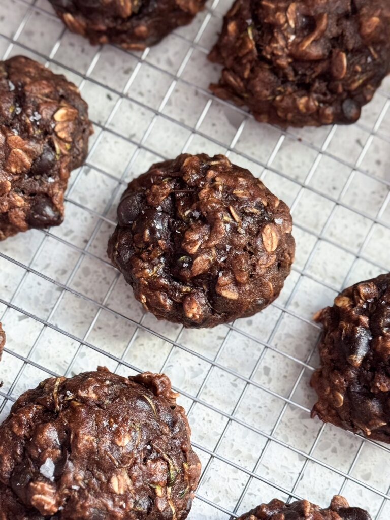 healthy double chocolate oat cookies close up on cooling rack